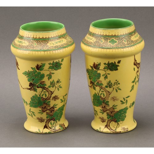 3133 - A pair of Shelley Chinoiserie vases, each in the decorated with cranes on a vermillion ground, 17cm ... 