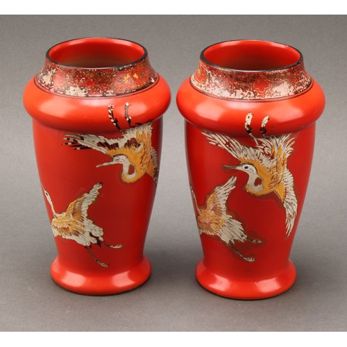 3133 - A pair of Shelley Chinoiserie vases, each in the decorated with cranes on a vermillion ground, 17cm ... 