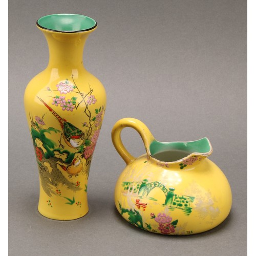 3133 - A pair of Shelley Chinoiserie vases, each in the decorated with cranes on a vermillion ground, 17cm ... 