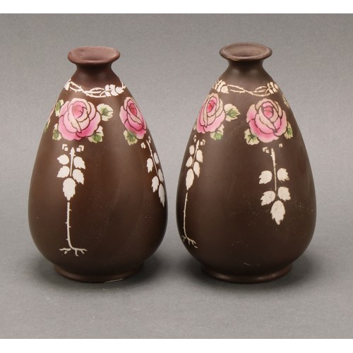 3136 - A pair of Shelley, Late Foley, Intarsio pattern ewers, decorated in polychrome with sinuous scrolls ... 