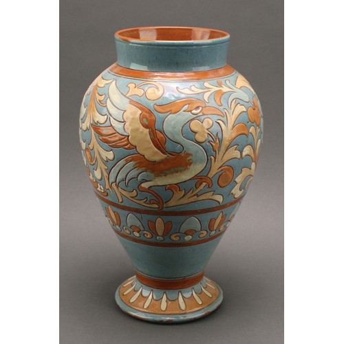 3018 - A CH Brannam Barnstaple inverted baluster vase, sgraffito incised with stylised griffin, 33cm high, ... 