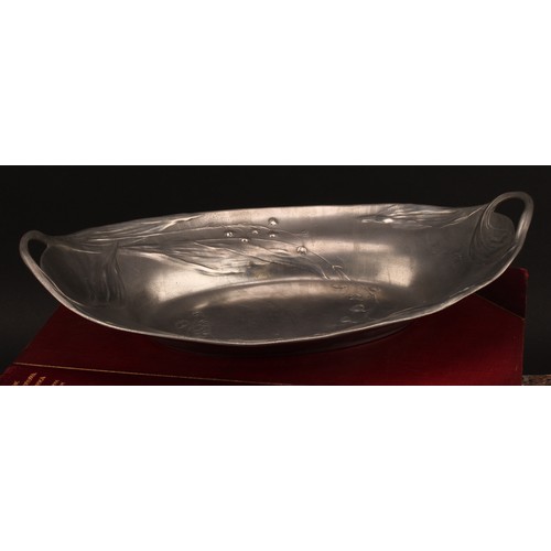 3314 - An Art Nouveau Kayserzinn pewter two handled oval dish, in relief with flowers, sinuous handles, 32c... 