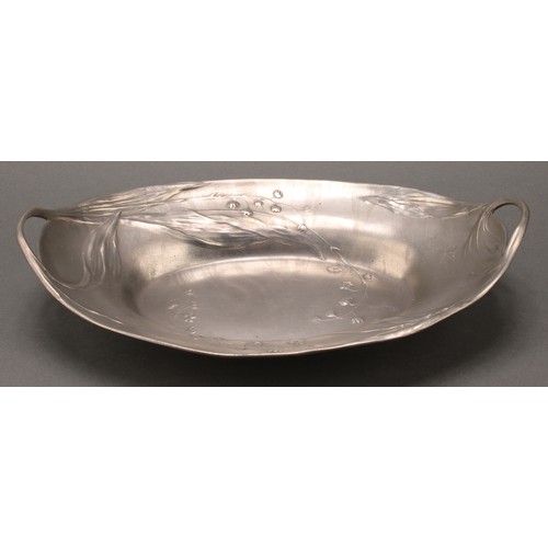 3314 - An Art Nouveau Kayserzinn pewter two handled oval dish, in relief with flowers, sinuous handles, 32c... 