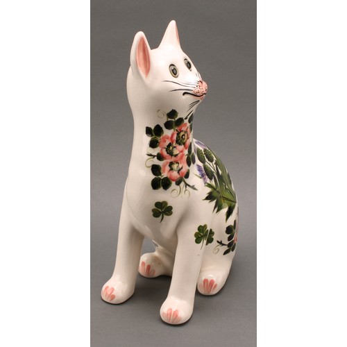 3033 - A pair of Griselda Hill Pottery ceramic cat models, painted with brightly coloured thistle and clove... 