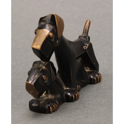 3261 - An Art Deco dark patinated bronze pair of stylised terriers, marked 