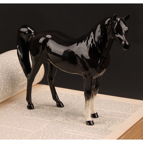 3067 - A Beswick model of a horse, Arab Xayal, in charcoal/black, model 1265, 16cm high, printed mark in go... 