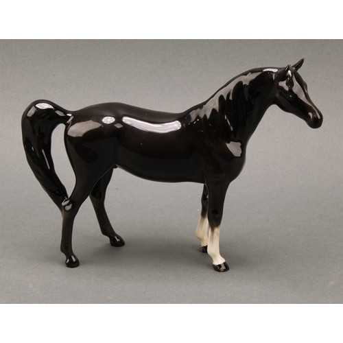 3067 - A Beswick model of a horse, Arab Xayal, in charcoal/black, model 1265, 16cm high, printed mark in go... 