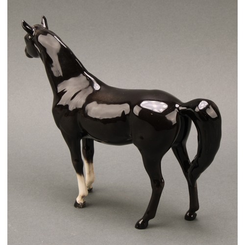 3067 - A Beswick model of a horse, Arab Xayal, in charcoal/black, model 1265, 16cm high, printed mark in go... 