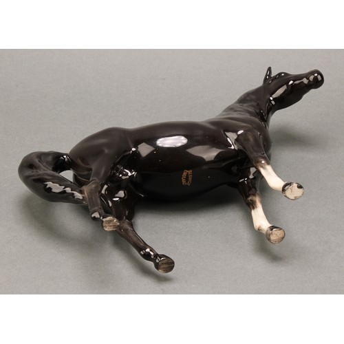 3067 - A Beswick model of a horse, Arab Xayal, in charcoal/black, model 1265, 16cm high, printed mark in go... 