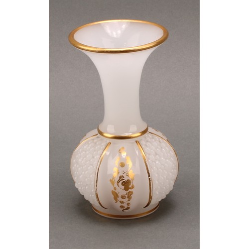 3221 - A late 19th century continental opaque white glass bottle vase, the body moulded with three panels o... 