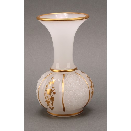 3221 - A late 19th century continental opaque white glass bottle vase, the body moulded with three panels o... 