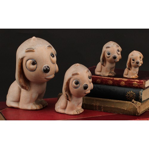 3098 - An unusual set of four Bourne Denby stoneware Fido dog graduated models, the tallest 15cm, the small... 