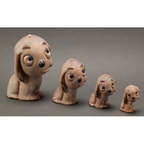 3098 - An unusual set of four Bourne Denby stoneware Fido dog graduated models, the tallest 15cm, the small... 