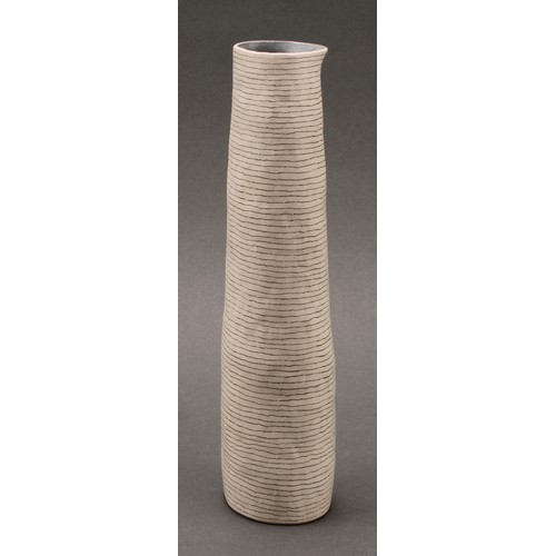 3215 - Susan Disley, a tall studio pottery slightly tapering cylindrical vase, 23cm high; a conforming cup,... 