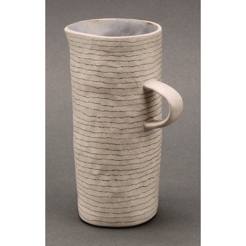 3215 - Susan Disley, a tall studio pottery slightly tapering cylindrical vase, 23cm high; a conforming cup,... 