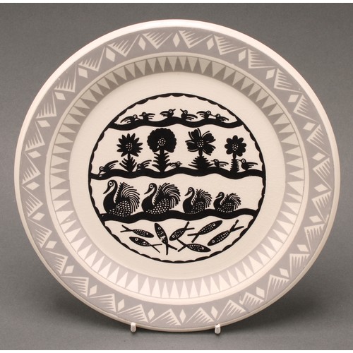 3040 - A Royal Worcester Crown Ware dinner plate, designed by Robert Scottie Wilson, transfer printed in mo... 