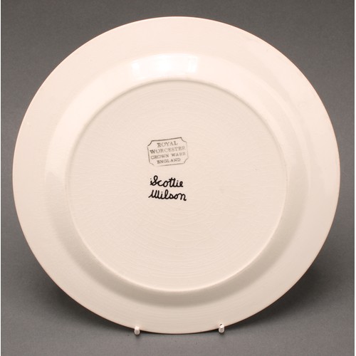 3040 - A Royal Worcester Crown Ware dinner plate, designed by Robert Scottie Wilson, transfer printed in mo... 