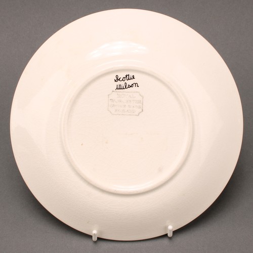 3040 - A Royal Worcester Crown Ware dinner plate, designed by Robert Scottie Wilson, transfer printed in mo... 