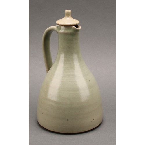 3187 - A Leach Pottery sake carafe and stopper with pair of conical sake glasses, glazed in celadon green, ... 