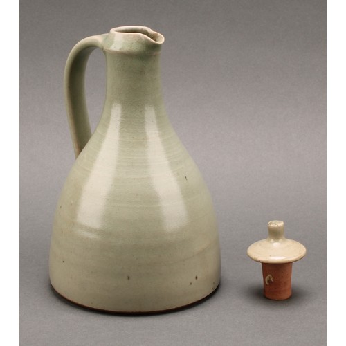 3187 - A Leach Pottery sake carafe and stopper with pair of conical sake glasses, glazed in celadon green, ... 