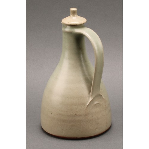 3187 - A Leach Pottery sake carafe and stopper with pair of conical sake glasses, glazed in celadon green, ... 