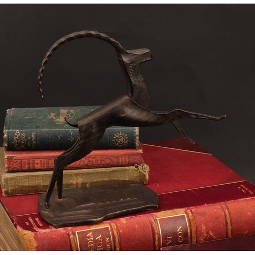 3265 - An Austrian dark patinated bronze and steel sculpture, stylised angular leaping Ibex, label to base,... 