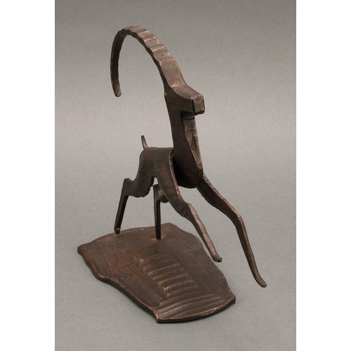 3265 - An Austrian dark patinated bronze and steel sculpture, stylised angular leaping Ibex, label to base,... 