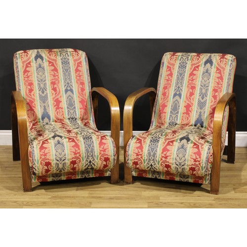 3348 - A pair of Art Deco oak club chairs or lounge chairs, in the manner of Heal's, London, 76cm high, 63c... 