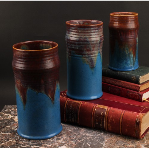 3097 - A graduated trio of Bourne Denby Danesby Orient Ware Brassington ribbed cylindrical vases, the large... 