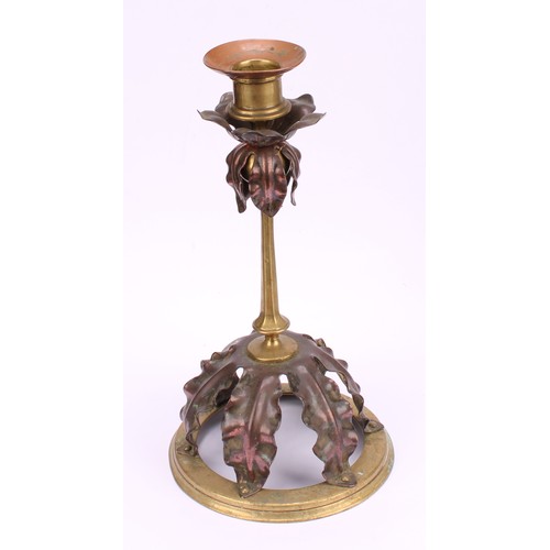 3251 - A pair of Arts and Crafts copper and brass candlesticks, in the manner of W A S Benson, each drip pa... 