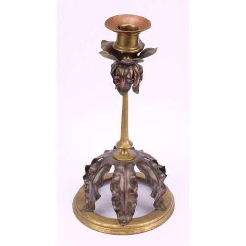 3251 - A pair of Arts and Crafts copper and brass candlesticks, in the manner of W A S Benson, each drip pa... 