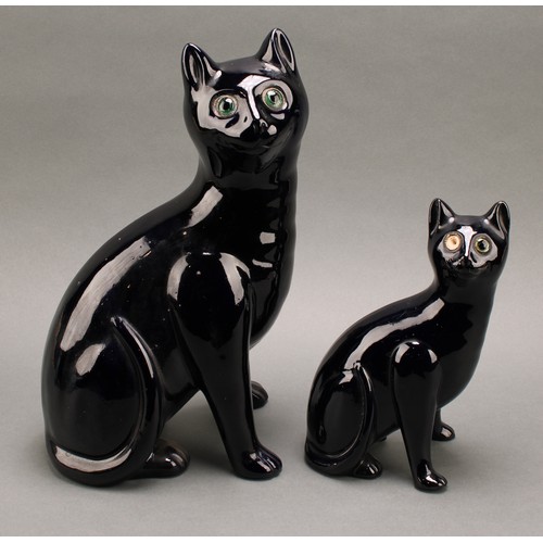 3068 - A Bretby model of a deep blue cat, green glass eyes, 35.5cm, number 2405H, impressed sunburst mark, ... 