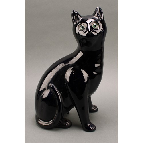 3068 - A Bretby model of a deep blue cat, green glass eyes, 35.5cm, number 2405H, impressed sunburst mark, ... 