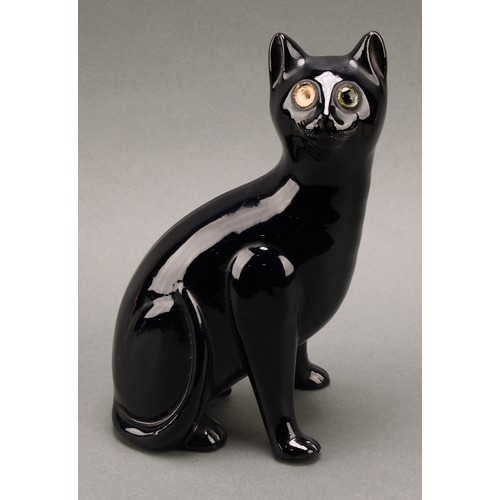 3068 - A Bretby model of a deep blue cat, green glass eyes, 35.5cm, number 2405H, impressed sunburst mark, ... 