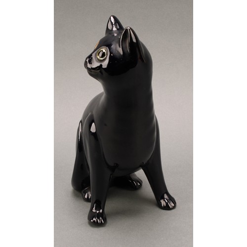 3068 - A Bretby model of a deep blue cat, green glass eyes, 35.5cm, number 2405H, impressed sunburst mark, ... 