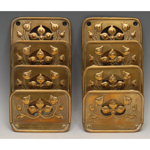 3250 - A pair of Art Nouveau brass wall mounted letter racks, by Samtico Art Metal Work, each pierced and e... 