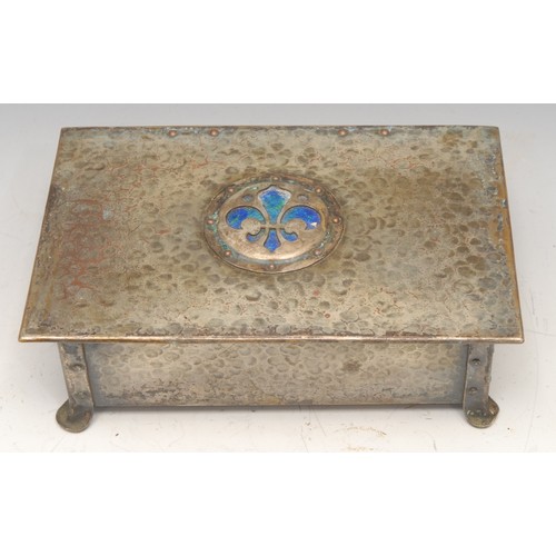 3256 - An Arts and Crafts enamel mounted rectangular casket, hinged cover centred by a fleur-de-lys in mott... 