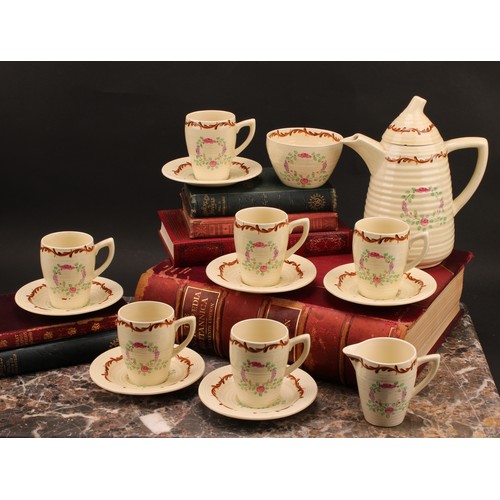 3004 - A Clarice Cliff coffee set, painted with floral garlands on a honey glaze ground, comprising ribbed ... 