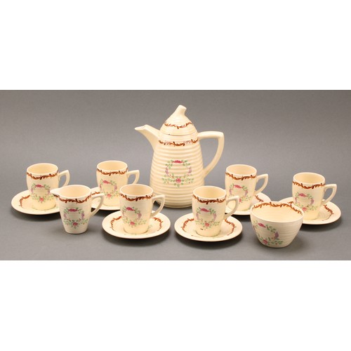 3004 - A Clarice Cliff coffee set, painted with floral garlands on a honey glaze ground, comprising ribbed ... 