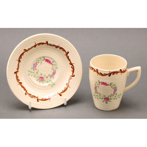 3004 - A Clarice Cliff coffee set, painted with floral garlands on a honey glaze ground, comprising ribbed ... 