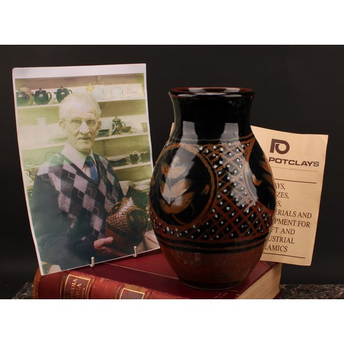 3212 - Studio Pottery - Derek Emms (1929-2004), a tenmoku and kaki glaze ovoid vase, decorated with stylise... 