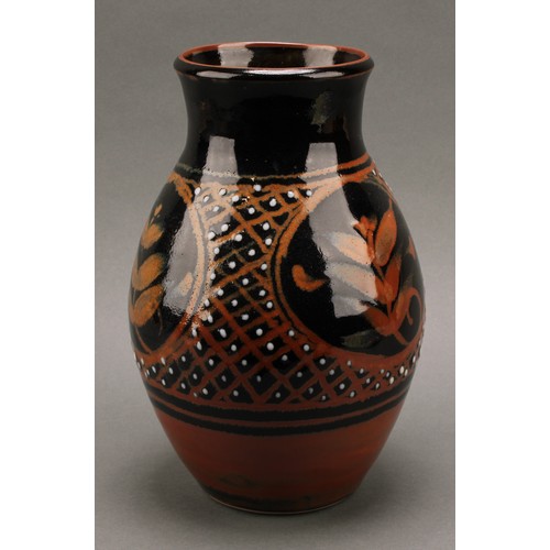 3212 - Studio Pottery - Derek Emms (1929-2004), a tenmoku and kaki glaze ovoid vase, decorated with stylise... 