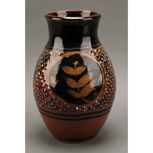 3212 - Studio Pottery - Derek Emms (1929-2004), a tenmoku and kaki glaze ovoid vase, decorated with stylise... 