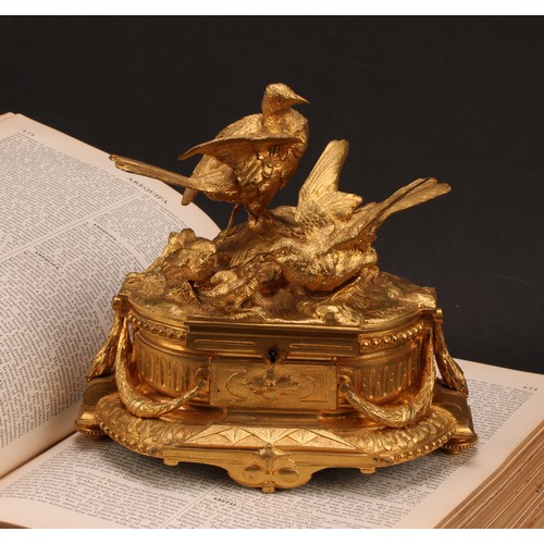 3310 - A 19th century French gilt bronze jewellery box, the hinged cover sculptured with birds by a rocky o... 