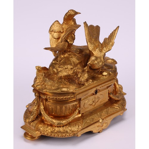 3310 - A 19th century French gilt bronze jewellery box, the hinged cover sculptured with birds by a rocky o... 