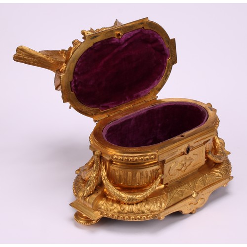 3310 - A 19th century French gilt bronze jewellery box, the hinged cover sculptured with birds by a rocky o... 