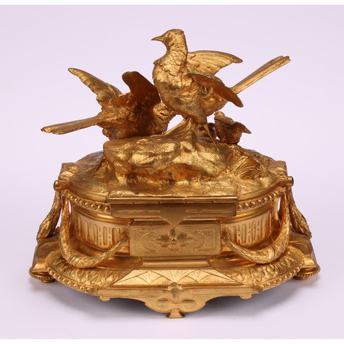 3310 - A 19th century French gilt bronze jewellery box, the hinged cover sculptured with birds by a rocky o... 