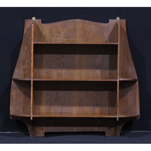 3418 - Liberty & Co - a set of Arts and Crafts oak 
wall shelves, 72cm high, 78cm wide, ivorine label to ve... 