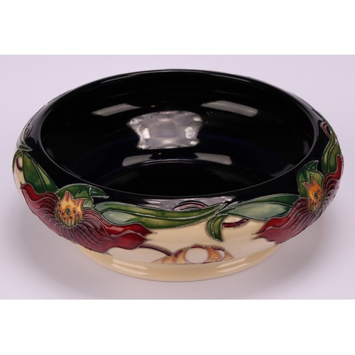 3108 - A modern Moorcroft pottery bowl in the Anna Lily pattern, designed by Nicola Slaney, of squat should... 