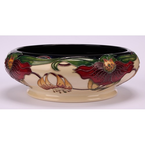 3108 - A modern Moorcroft pottery bowl in the Anna Lily pattern, designed by Nicola Slaney, of squat should... 